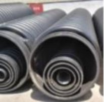 Composite pipe made from upcycled coal waste material
